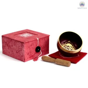 Bol chantant chakra racine en laiton doré et rougeavec baguette en bois, 8 cm, fabriqué en Inde.