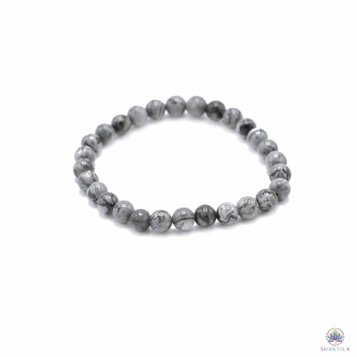 Bracelet Perles Map Stone (Jaspe) — Prospérité 1 Bracelet map stone : perles gris clair veinées de lignes noires, posé à plat sur fond blanc