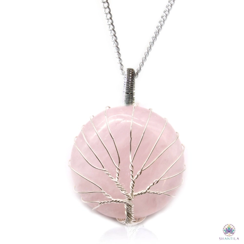 Collier Arbre de Vie Quartz Rose 1 Collier arbre de vie quartz rose : un disque rose pâle et laiteux, sur sa chaîne argentée, fond blanc